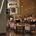 Rayentray Grand Hotel in Puerto Madryn lounge with striped chairs and tables in a modern interior