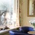 Hotel Kölner Hof Refrath lounge with blue armchairs, table and flowers in Bergisch Gladbach