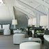 Hospes Las Casas del Rey de Baeza in Seville, stylish lounge with wicker seating and white lamps