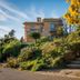 Hotel La Voile in Bormes-les-Mimosas, stone steps beside lush garden and a hotel building
