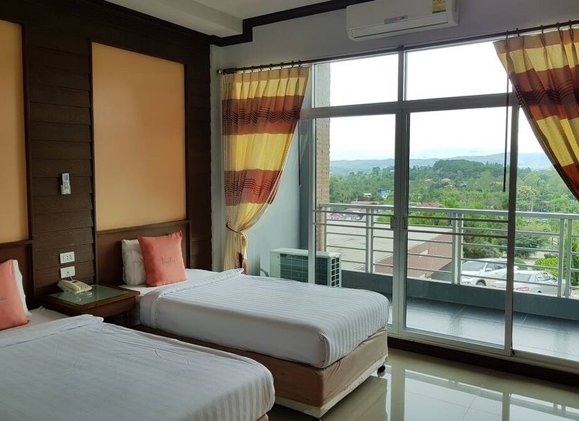 Breeze Hill Resort Khao Kho room with twin beds and balcony view of green hills
