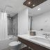 West Coast Suites At Ubc bathroom in Vancouver with tub-shower combo, vanity sink and toilet