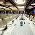 Changle Inn in Yangzhou banquet hall with long set dining table and large screen showing an airplane