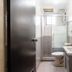 Sipadan Inn 1 Semporna bathroom with shower, toilet, sink and mirror
