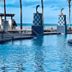 Shores of Panama Resort in Panama City Beach: beachfront pool with ocean view and dolphin-topped columns
