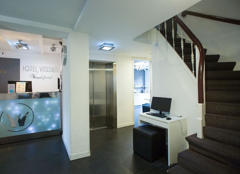 Hotel Vossius Vondelpark Amsterdam lobby with reception desk, elevator and staircase