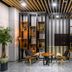 Hotel With Jeju in Jeju City lobby seating area with wood slat ceiling and display shelves