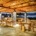 Abaton Island Resort & Spa in Hersonissos outdoor dining terrace with city and sea views
