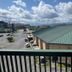 Grand Smokies Resort Lodge in Pigeon Forge with mountain views over rooftops and a partly cloudy sky