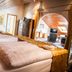 Hotel-Restaurant Barbarossahof room in Kaiserslautern with twin beds, wardrobe and arched doorway