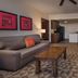 Disney's Animal Kingdom Villas - Kidani Village in Lake Buena Vista living room with sofa, coffee table, and dining area