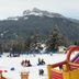 Th Cadore - Hotel Antelao in Borca di Cadore with snowy mountain views and an inflatable playground