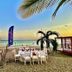 Playa Blanca Beach Resort in Río Hato with beachfront dining setup and ocean views at sunset