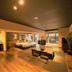 Livemax Resort Aki Miyajima in Hatsukaichi with spacious room, king bed, seating area and balcony view
