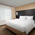 Residence Inn by Marriott Lubbock Southwest guest room with king bed and large window with curtains