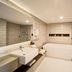 Novotel Wollongong Northbeach bathroom with freestanding tub, walk-in shower and wall-mounted sink