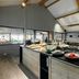 Hotel Katla by Keahotels in Vik buffet dining area with assorted dishes and high vaulted ceiling