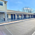 Red Carpet Inn & Suites Morgantown exterior with motel-style rooms and parking lot