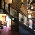 Premier Inn Milton Keynes South lobby with grand staircase, brick pillars and dining area in Milton Keynes