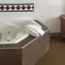 Motel 6 Portland, IN in Portland: corner jetted tub with folded towels in a guest room