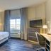 Candlewood Suites New Bern by IHG guest room with king bed, desk, TV and window view