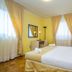 Apartments with Pool Villa Rossella 1 in Rovinj: bright bedroom with double bed and curtains