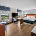 Hampton Inn & Suites Ft. Lauderdale West-Sawgrass/Tamarac room with king bed, desk, and window view in Tamarac