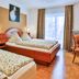 Zum Ochsen Schallstadt guest room with twin beds, desk, chairs and balcony door