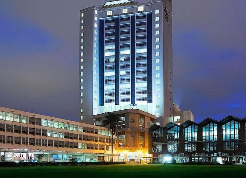 Boma Inn Nairobi in Nairobi at dusk, with a tall illuminated tower and low glass buildings
