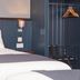 Corner House Inn by Greene King Inns, Newcastle upon Tyne: single bed with wall lamp and clothes rack