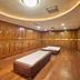 Tianheng International Hotel in Jinhua locker room with wooden lockers and benches