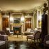 Le Dokhan's, Paris Arc de Tiromphe, a Tribute Portfolio Hotel lounge with fireplace and classic seating in Paris