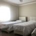 Nur Apart, Marmaris: simple guest room with three single beds and a bright window