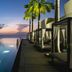 Silversands Grand Anse in St. George's features an infinity pool beside cabanas at sunset.