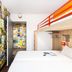 Hotelf1 Bordeaux Nord Lormont room with bunk bed and colorful poster-covered walls