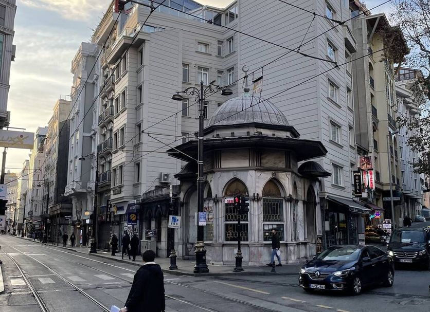 Old City Viva Hotel in Istanbul on a street corner with tram tracks and surrounding city buildings