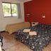 K - Town Hotel Katherine room with double bed, single bed, window, and tiled floor