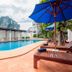 Sabai Mansion Pool & Spa in Krabi with outdoor pool, lounge chairs and blue umbrellas, plus mountain views