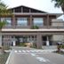 Ocean Resort Pmc in Onna with palm trees, modern resort facade, and covered entrance