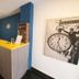 Premium Crown Suites Belgrade lobby reception desk with blue accent wall and stairway