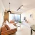 Pavo Art Hotel in Heraklion room with sofa, glass coffee table, wall TV and balcony view
