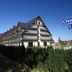Hotel Paryski Art & Business in Zakopane with chalet-style balconies and mountain backdrop