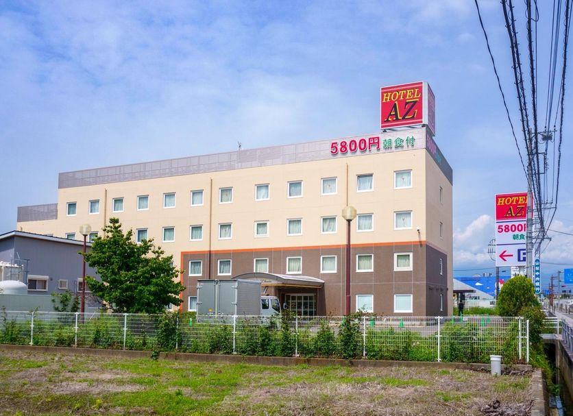 Hotel Az Yamanashi Kofuminami I.C. Ten in Kōfu exterior with roadside sign and parking area