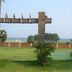 Nalla Eco Beach Resort in Pondicherry with lawn, beach view, and wooden archway