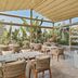 Staybridge Suites Cairo - Citystars by IHG indoor-outdoor lounge with glass walls and patio seating
