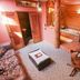 Gold Mountain Manor in Big Bear, rustic guest room with wood stove, tub, and sitting area