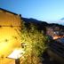 Suminoyu in Yamanouchi with mountain and town views from a rooftop terrace at dusk