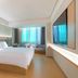 Ji Hotel Guiyang Fountain guest room with king bed, sofa, and large window in Guiyang