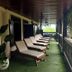 Hacienda el Jibarito in San Sebastián terrace with lounge chairs and green carpeted porch