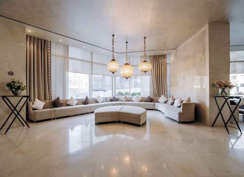 Qafqaz Sahil Hotel Baku lobby lounge in Baku with curved sectional seating and pendant lights